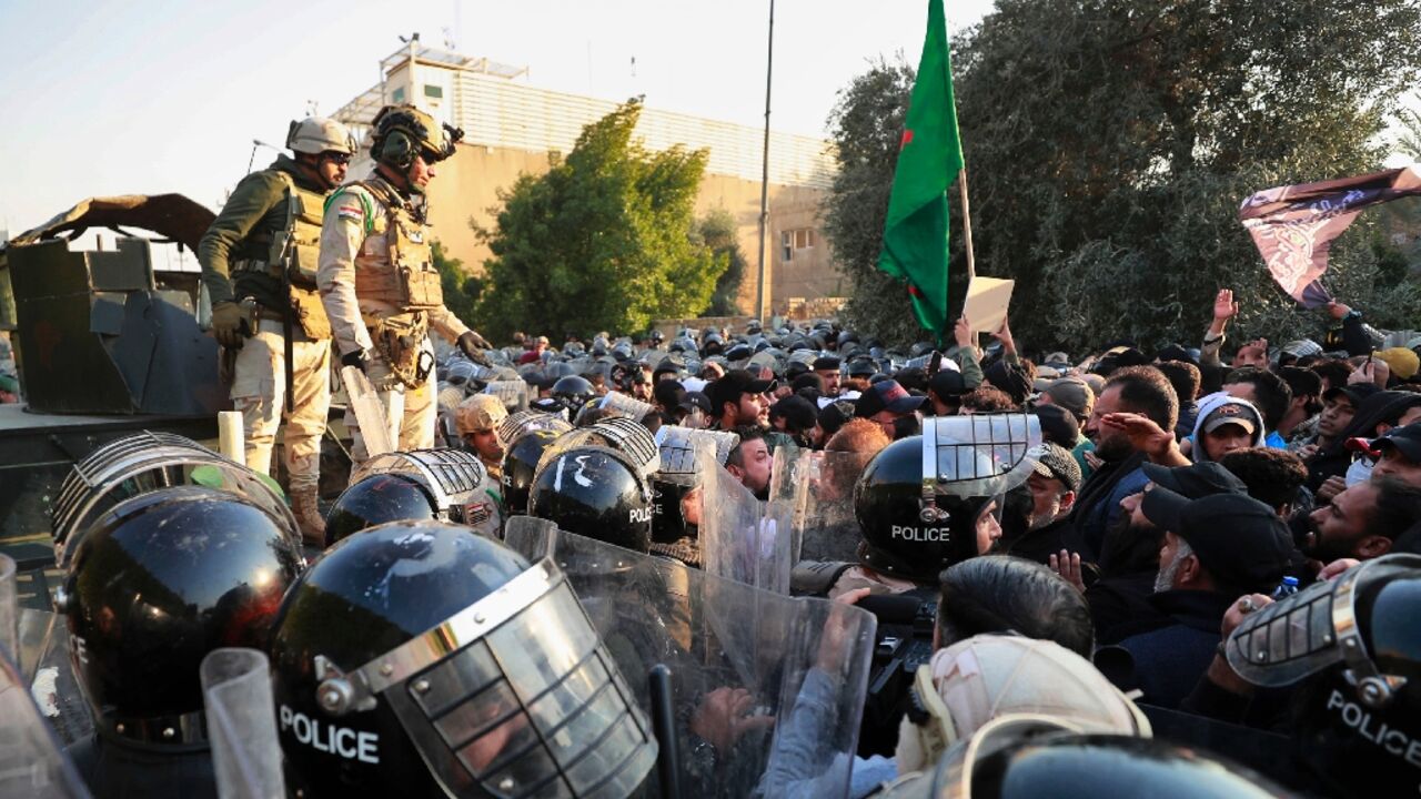 Iraqi riot police prevent protesters from reaching the Swedish embassy in Baghdad on January 23, 2023 Iraqi riot police prevent protesters from reaching the Swedish embassy in Baghdad on January 23, 2023