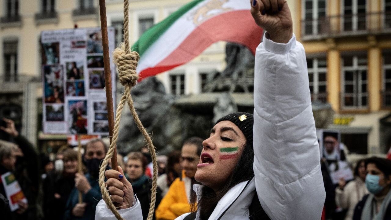 A protester holds a gallows rope during a rally in the French city of Lyon on January 8 against the Iranian regime