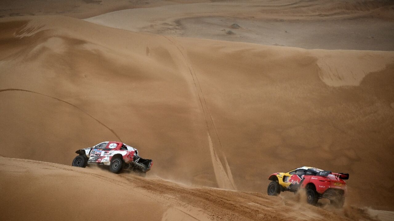 Sebastien Loeb chasing Giniel de Villiers in stage eight. The Frenchman passed the South African Toyota driver in the stage and the overall rankings Sebastien Loeb chasing Giniel de Villiers in stage eight. The Frenchman passed the South African Toyota driver in the stage and the overall rankings