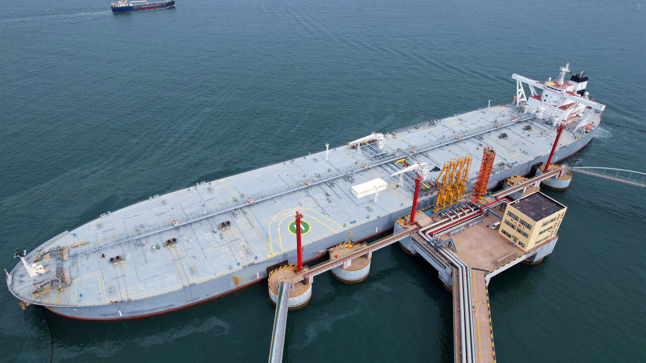 An oil tanker unloads imported crude oil at Qingdao port in China's eastern Shandong province on May 9, 2022.  (Photo by STR/AFP via Getty Images)