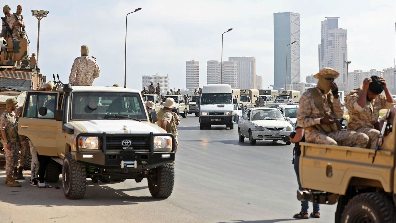 Vehicles of forces loyal to Tripoli-based Prime Minister Abdul Hamid Dbeibah are parked along the waterfront, hours after forces of the rival Tobruk-based government withdrew following heavy fighting between opposing militiasTripoli, Libya, May 17, 2022.