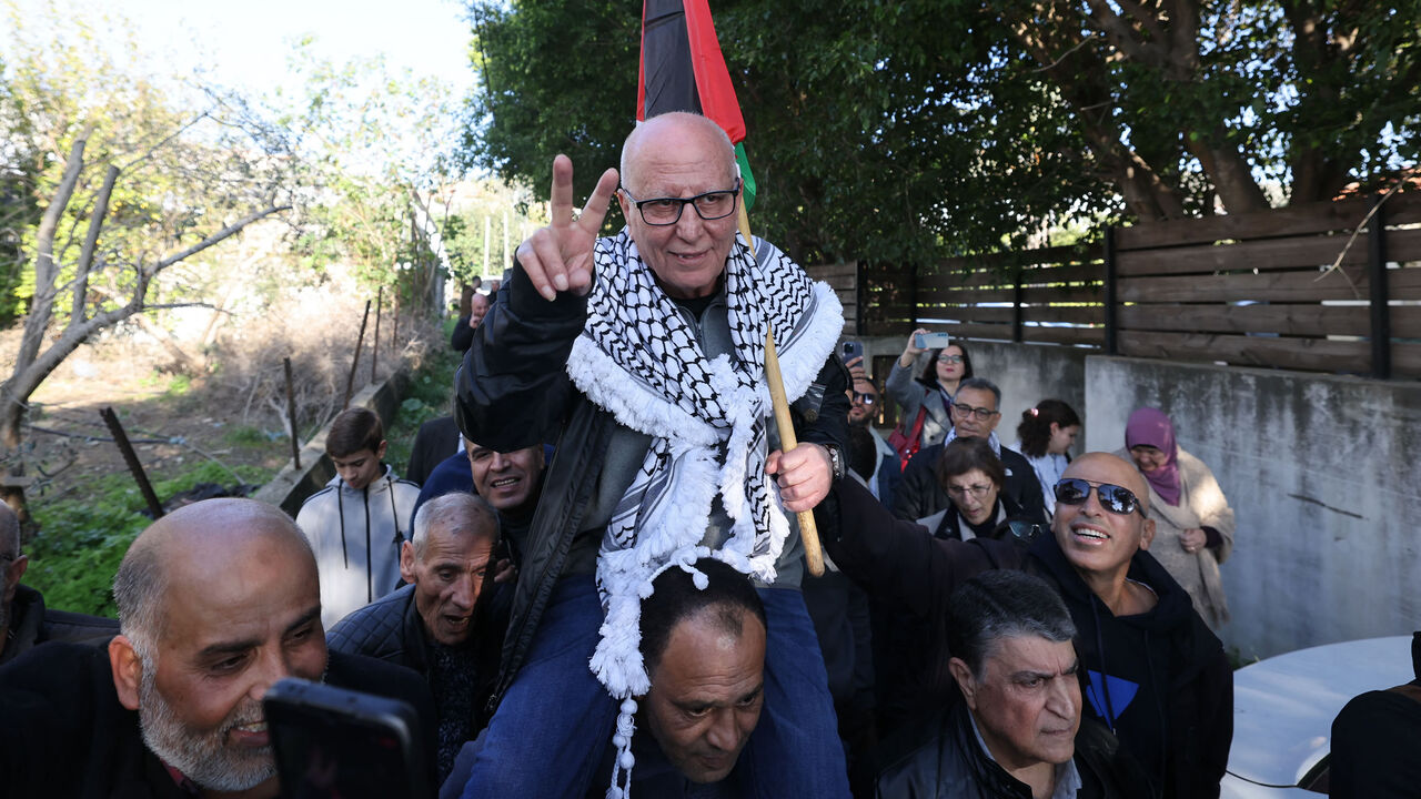 Arab Israeli Karim Younes is carried by friends and relatives following his release after 40 years in an Israeli prison for kidnapping and murdering an Israeli soldier, Ara, Israel, Jan. 5, 2023.