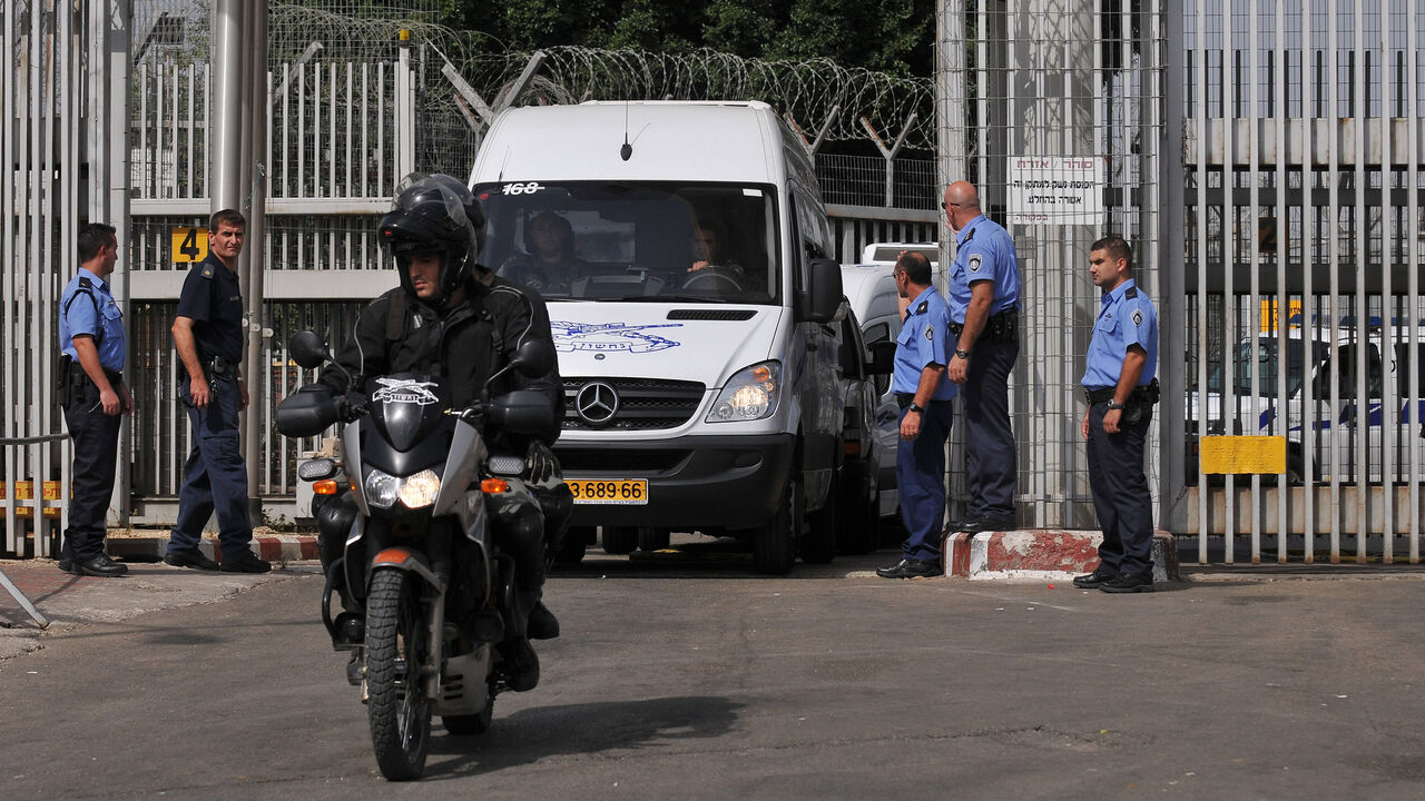 Israeli police vans carrying 19 Palestinian women leave Hadarim prison, near the coastal city of Netanya, Israel, Oct. 2, 2009.