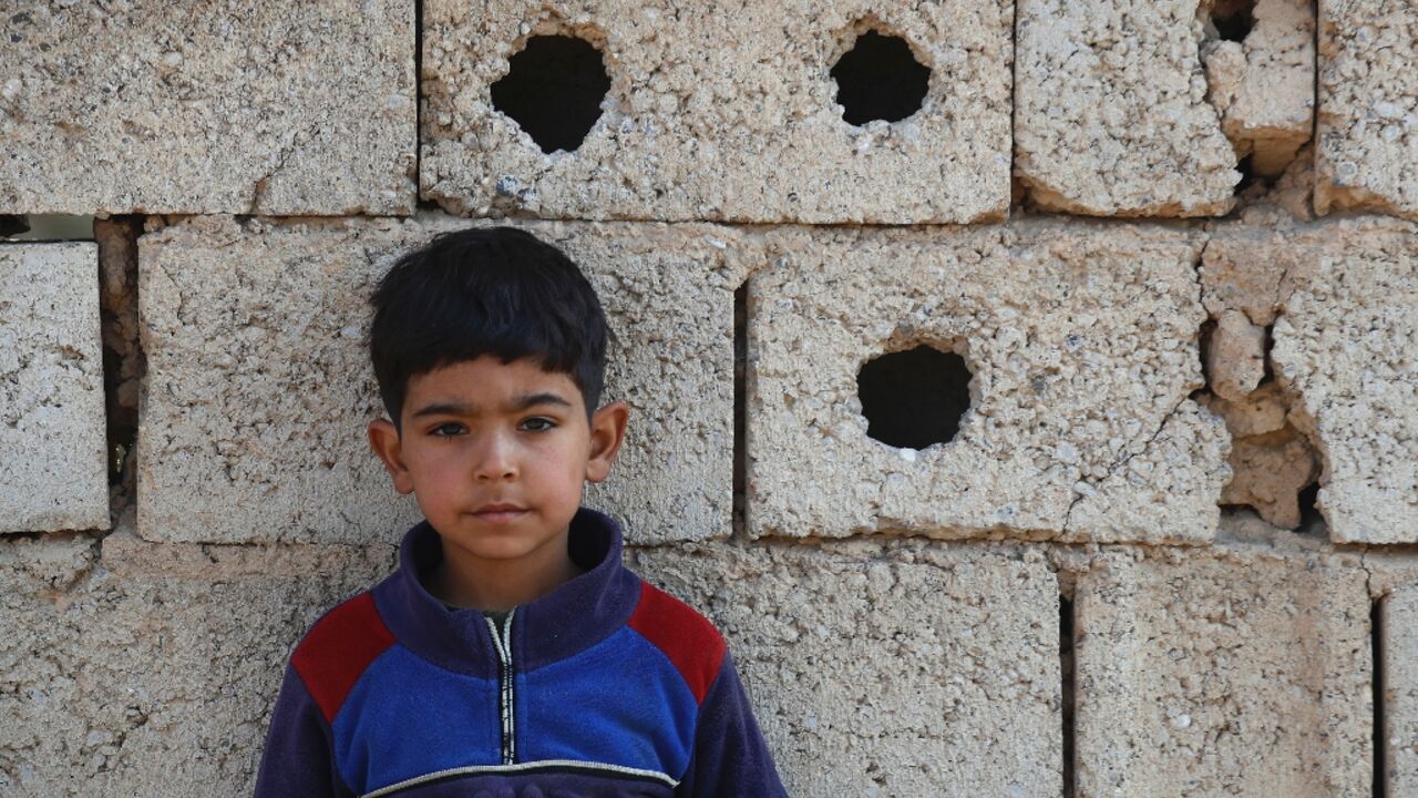 A young boy is pictured in the Iraqi village of Albu Bali where eight people were killed in an attack by Islamic State group jihadists last month A young boy is pictured in the Iraqi village of Albu Bali where eight people were killed in an attack by Islamic State group jihadists last month