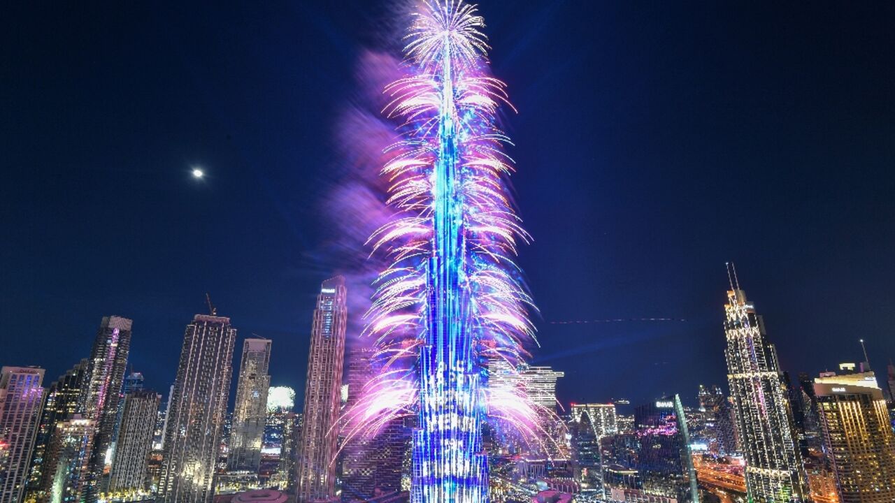New Year's Eve fireworks light the landmark Burj Khalifa tower at midnight in the Gulf emirate of Dubai on December 31, 2022 New Year's Eve fireworks light the landmark Burj Khalifa tower at midnight in the Gulf emirate of Dubai on December 31, 2022