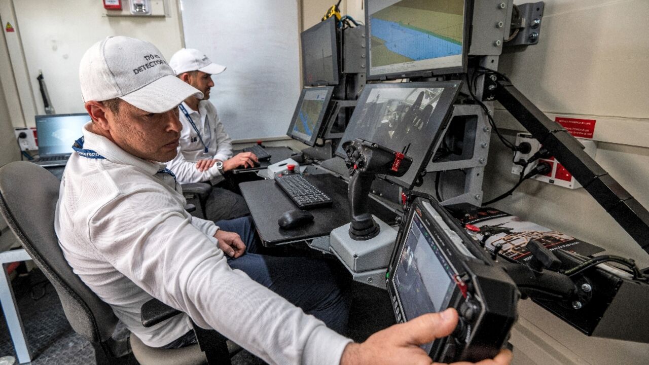 Controllers man a terminal at the command station of the Israel Aerospace Industries in an unmanned maritime demonstration during the Naval Defence and Maritime Security Exhibition (NAVDEX) at the Abu Dhabi International Exhibition Centre Controllers man a terminal at the command station of the Israel Aerospace Industries in an unmanned maritime demonstration during the Naval Defence and Maritime Security Exhibition (NAVDEX) at the Abu Dhabi International Exhibition Centre