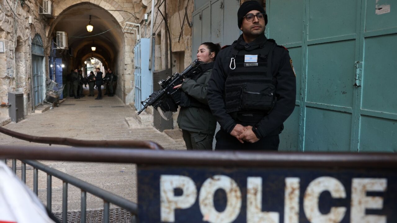 Israeli police stand guard in Jerusalem's Old City following a reported stabbing attack on February 13 