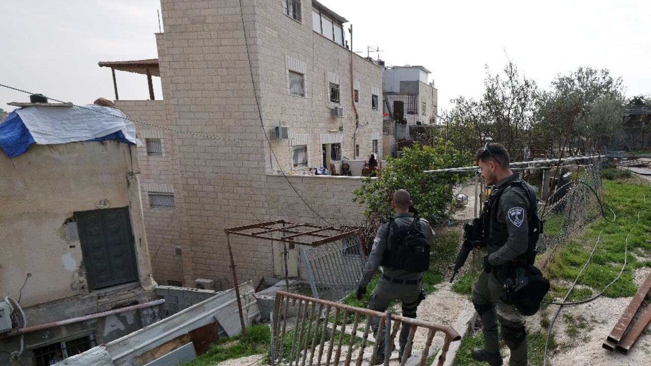 Israeli soldiers arrive at the east Jerusalem family home of Khayri Alqam, who killed seven people outside a Jewish settlement synagogue