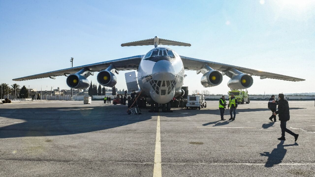 Aid parcels for earthquake victims are unloaded from a Saudi aircraft in Syria's second city Aleppo, the first flight from the kingdom since Riyadh broke off relations more than a decade ago