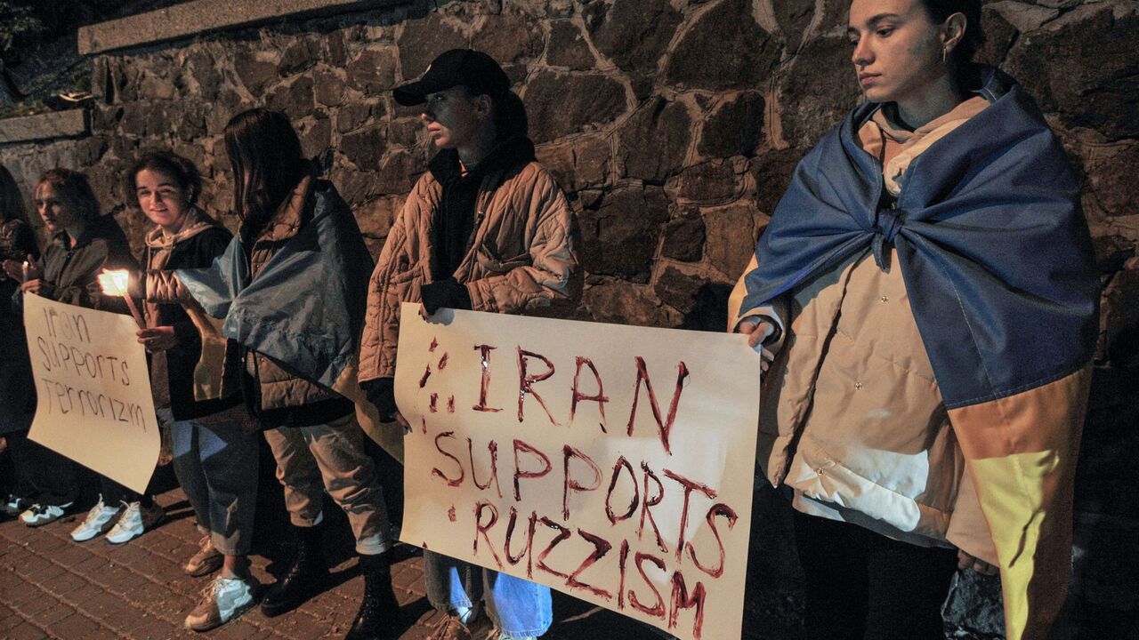 People demonstrate outside the Iranian embassy in Ukraine on October 17, 2022 in Kyiv, after the city was hit by swarms of kamikaze drones sold by Iran to Russia, leaving at least three dead. (Photo by SERGEI CHUZAVKOV/AFP via Getty Images)