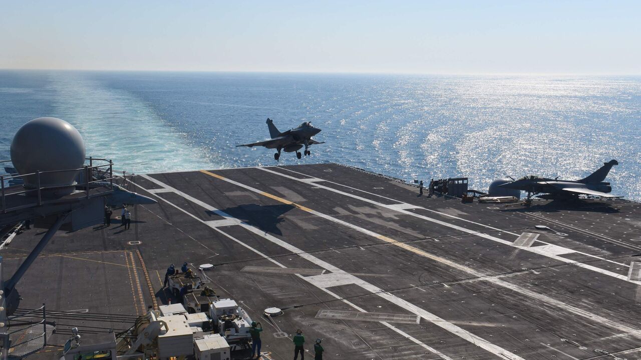 A French Navy Rafale jet lands the deck of the USS George H.W. Bush aircraft carrier on May 11, 2018 in the Atlantic Ocean. 