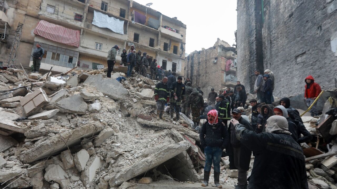 Syrian rescue teams search for victims and survivors at the rubble a collapsed building in the city of Aleppo Syrian rescue teams search for victims and survivors at the rubble a collapsed building in the city of Aleppo