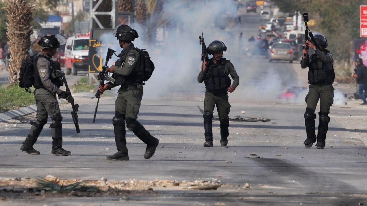 Israeli soldiers clash with Palestinian youths during the raid in Jericho Israeli soldiers clash with Palestinian youths during the raid in Jericho