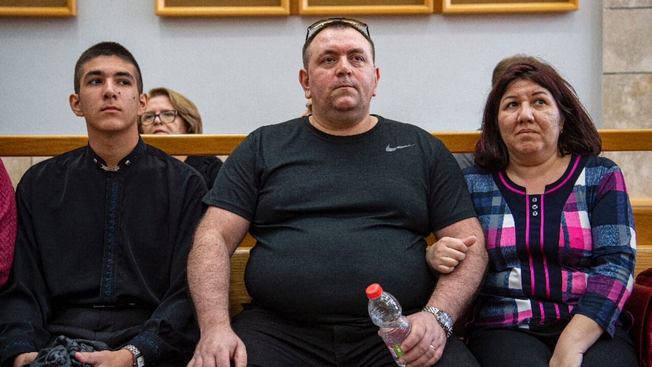 Roman Zdorov (C) burst into tears when the court freed him more than 16 years after he was first imprisoned over a schoolgirl's murder Roman Zdorov (C) burst into tears when the court freed him more than 16 years after he was first imprisoned over a schoolgirl's murder