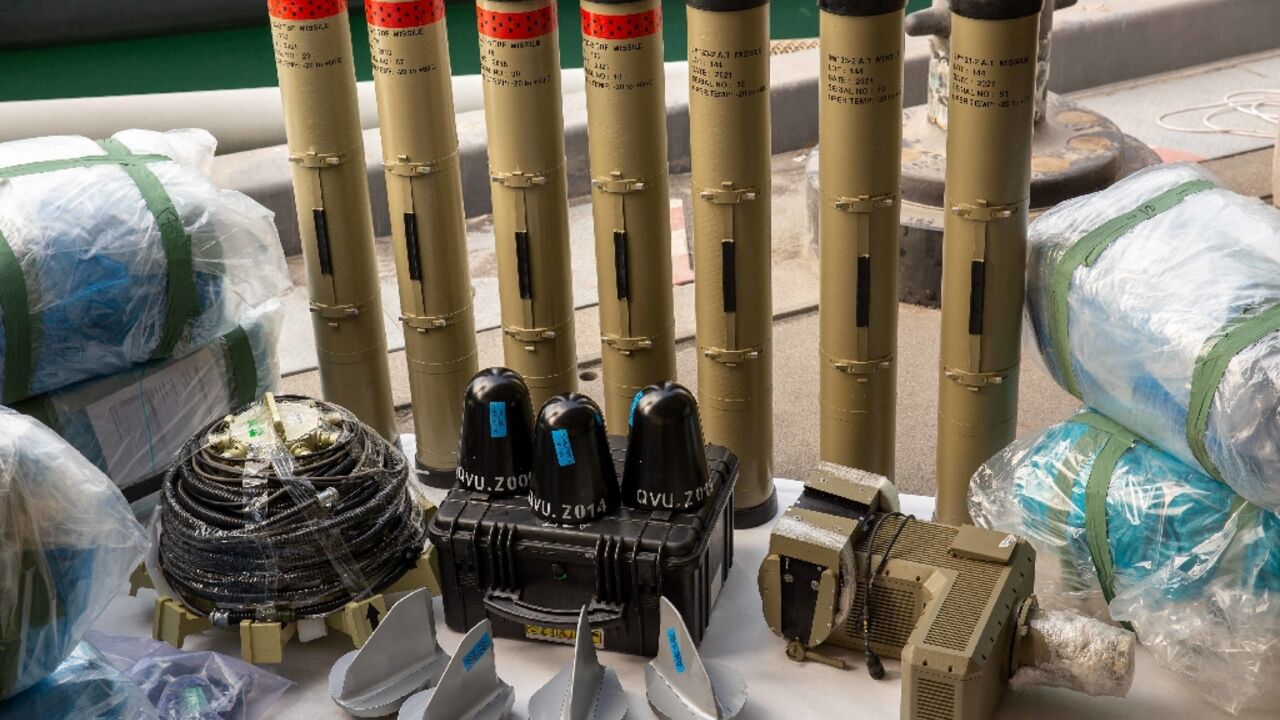 The US Navy displays weapons it says were seized from the intercepted vessel, including Iranian versions of Russia's Kornet anti-tank missile and medium-range ballistic missile components