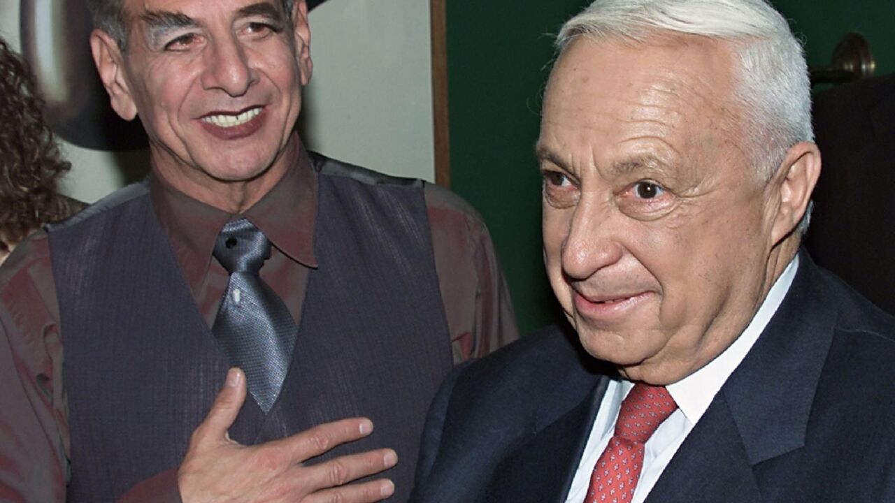 Israeli actor Chaim Topol famed for playing Tevye in the film "Fiddler on the roof" has died aged 87. The Golden Globe winner is seen in this 2001 alongside late Israeli premier Ariel Sharon 