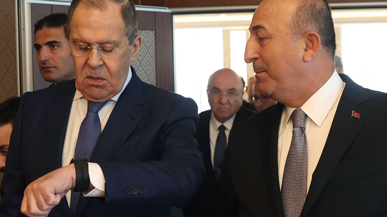 Russian Foreign Minister Sergei Lavrov (L) and Turkish Foreign Minister Mevlut Cavusoglu (R) speak after a news conference in Ankara, on June 8, 2022. -