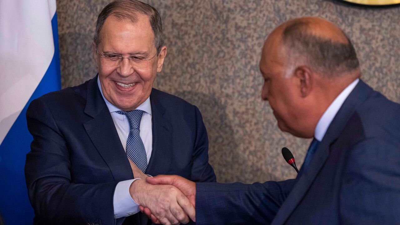 Egyptian Foreign Minister Sameh Shokry (R) and his Russian counterpart Sergei Lavrov shake hands during a joint press conference in the capital Cairo, on July 24, 2022. - Russia's top diplomat will address the Arab League at its Cairo headquarters, the organisation said, days after Russia took part in a summit hosted by Iran, a regional rival of some Arab states. (Photo by KHALED DESOUKI/AFP via Getty Images)