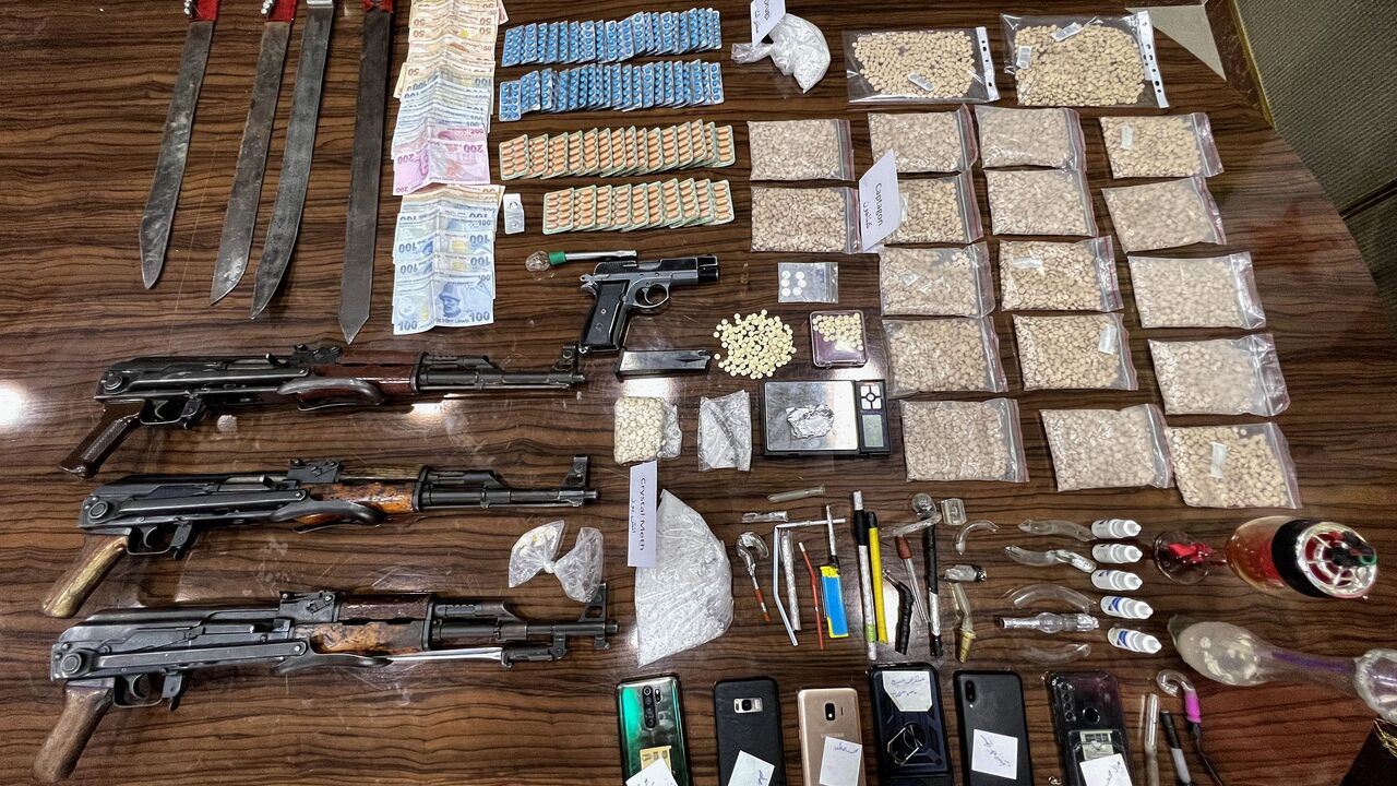 Seized drugs, including Captagon, are displayed for the media in the town of Marea, in the northern Aleppo countryside, on May 24, 2022, following clashes among different Turkey-backed factions in Syria. - A decade of appalling civil war has left Syria fragmented and in ruins but one thing crosses every frontline: the drug fenethylline, commercially known as captagon. The stimulant -- once notorious for its association with Islamic State fighters -- has spawned an illegal $10-billion industry that not only