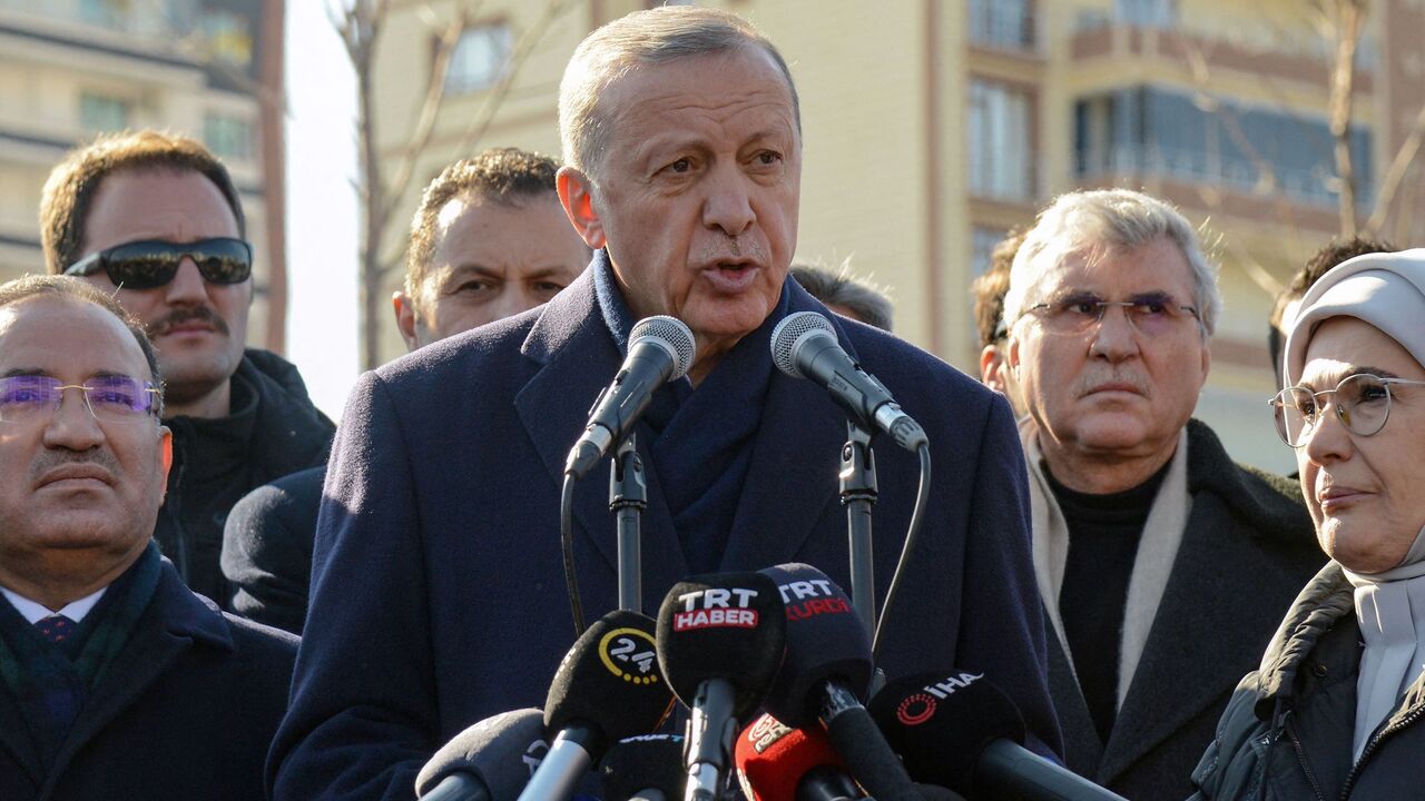 Turkish President Recep Tayyip Erdogan talks to the press during his visit to the hard-hit southeastern Turkish city of Diyarbakir.