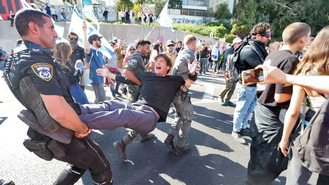Israeli forces disperse a protest against the government's controversial judicial reform bill in Tel Aviv on March 9, 2023. (Photo by JACK GUEZ/AFP via Getty Images