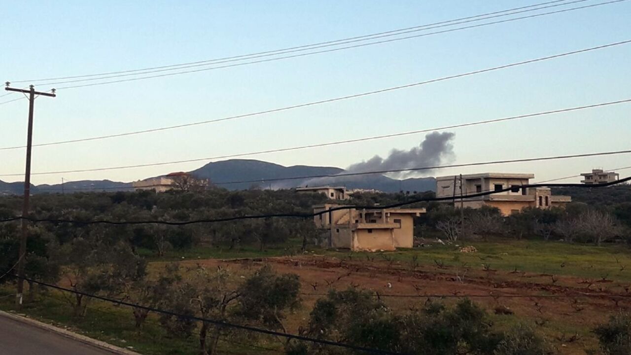 Smoke billows from the site reportedly targeted by Israeli airstrikes in this image released by the official Syrian Arab News Agency