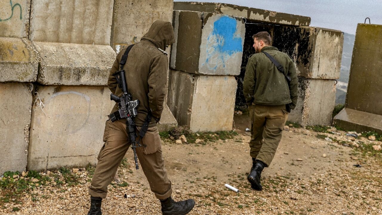 Israeli soldiers patrol the border with Lebanon near the northern village of Arab al-Aramshe after the army announced that a suspect killed inside Israel this week was wearing an explosive belt and believed to have crossed from Lebanon Israeli soldiers patrol the border with Lebanon near the northern village of Arab al-Aramshe after the army announced that a suspect killed inside Israel this week was wearing an explosive belt and believed to have crossed from Lebanon