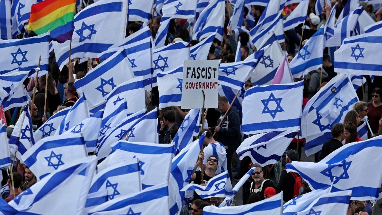 Protesters gather with national flags outside Israel's parliament in Jerusalem against the hard-right government's controversial push to overhaul the justice system