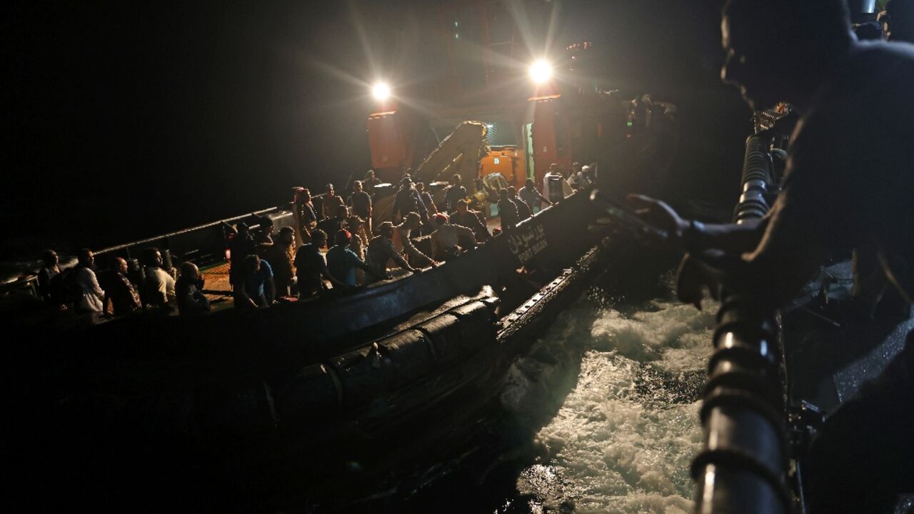 Before dawn, evacuees from Sudan's war boarded a tugboat which transported them out to a Saudi Arabian warship