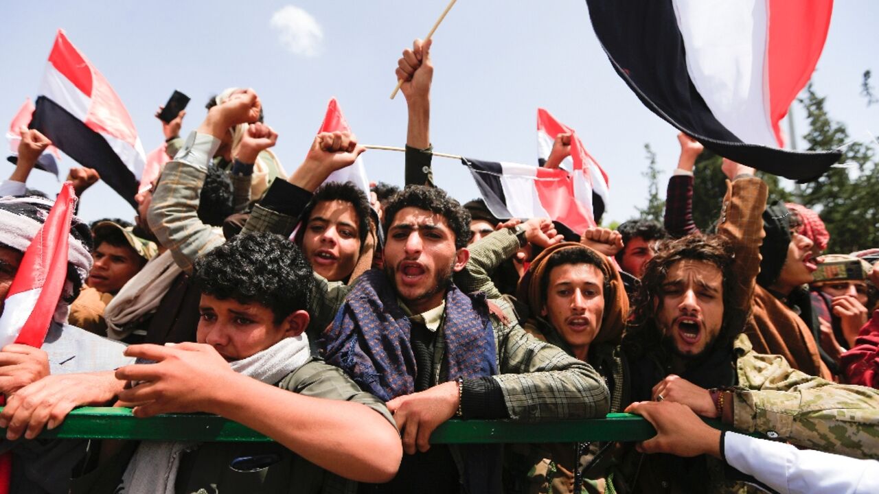 Yemenis await the arrival of freed prisoners at Sanaa airport