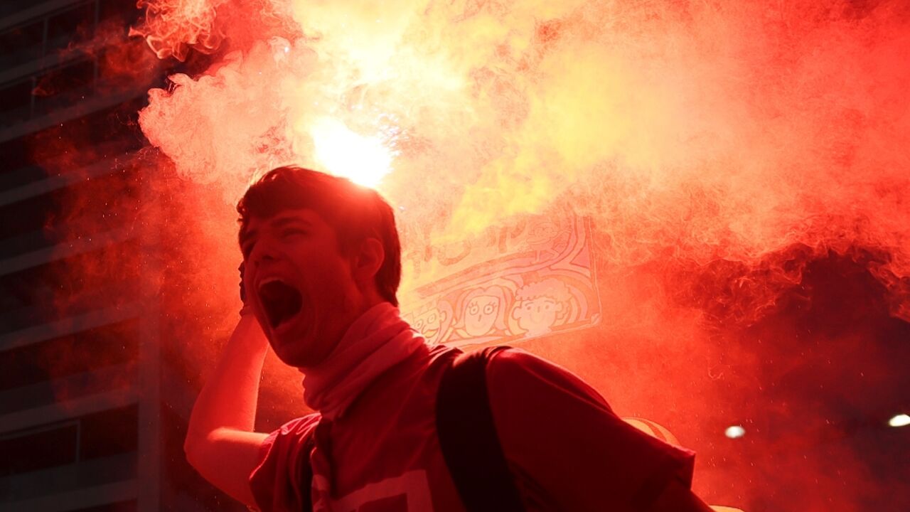 A protester brandishes a flare during protests in Tel Aviv against the government's judicial reform bill A protester brandishes a flare during protests in Tel Aviv against the government's judicial reform bill
