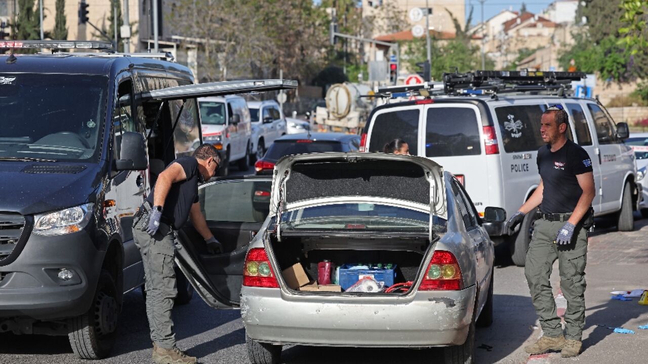 Israeli security forces inspect a vehicle following a shooting attack in the neighbourhood of Sheikh Jarrah in annexed east Jerusalem Israeli security forces inspect a vehicle following a shooting attack in the neighbourhood of Sheikh Jarrah in annexed east Jerusalem