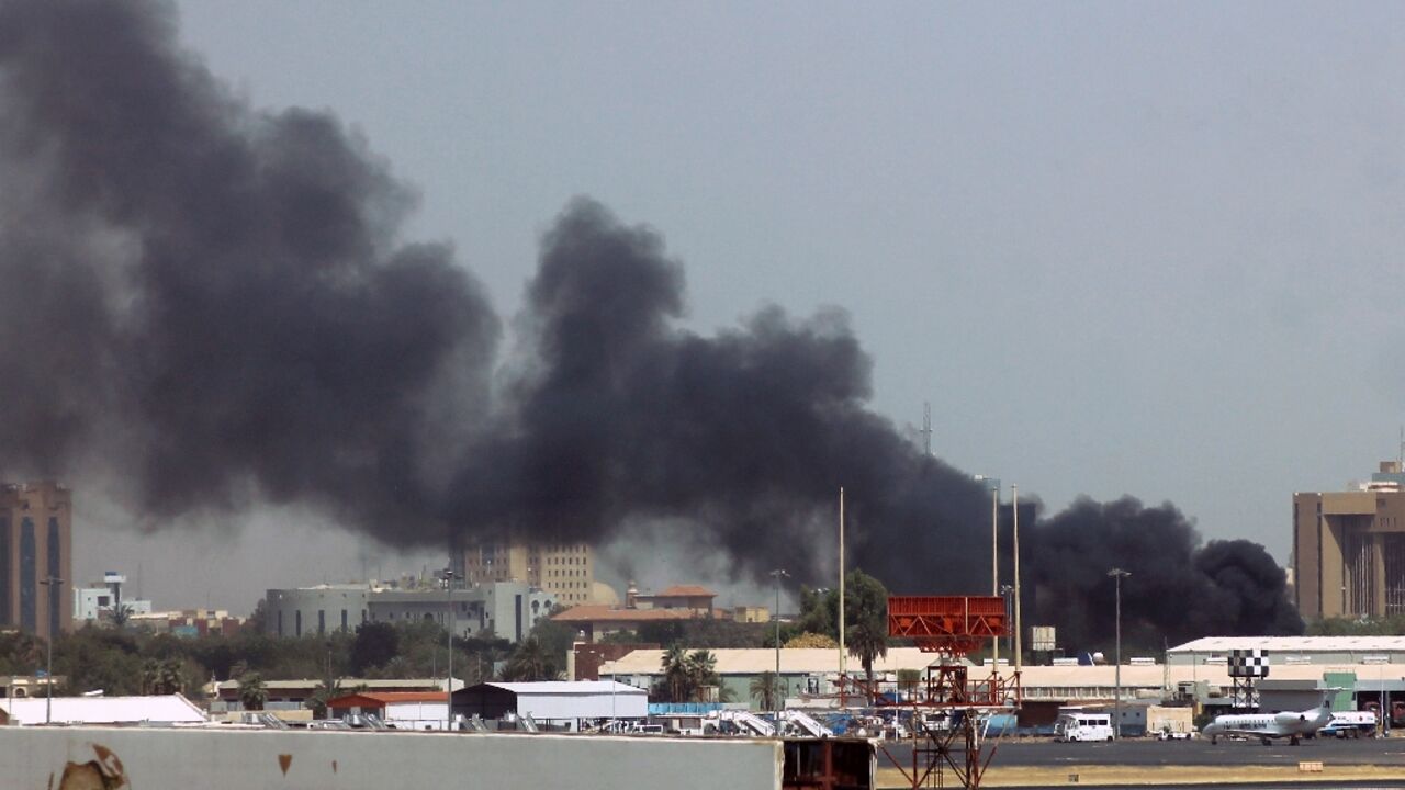 Heavy smoke billows over Khartoum airport where the Sudanese army accuses a rival paramilitary force of setting fire to civilian aircraft Heavy smoke billows over Khartoum airport where the Sudanese army accuses a rival paramilitary force of setting fire to civilian aircraft