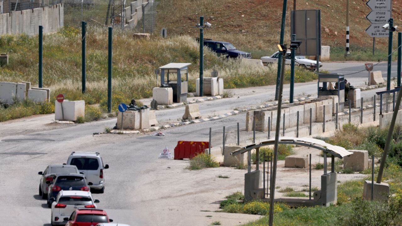 Motorists wait at Hamra junction in the occupied West Bank after the Israeli army closed it in its search for the perpetrators of a deadly shooting attack