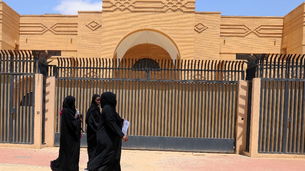 Women walk past the closed Iranian embassy in the Saudi capital Riyadh Women walk past the closed Iranian embassy in the Saudi capital Riyadh