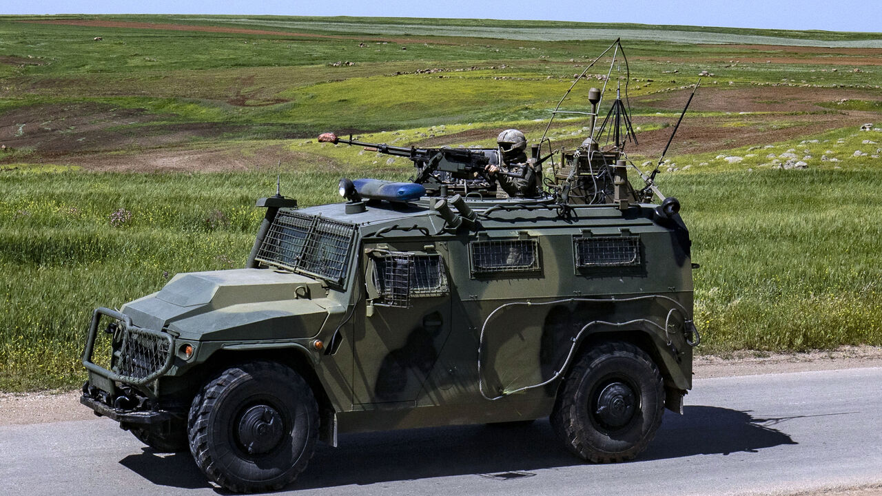 A soldier mans a machine gun mounted on an army vehicle during a Turkish and Russian military patrol in the countryside of Rumaylan (Rmeilan), in Syria's northeastern Hasakeh province bordering Turkey, on April 27, 2023. (Photo by Delil souleiman / AFP) (Photo by DELIL SOULEIMAN/AFP via Getty Images)