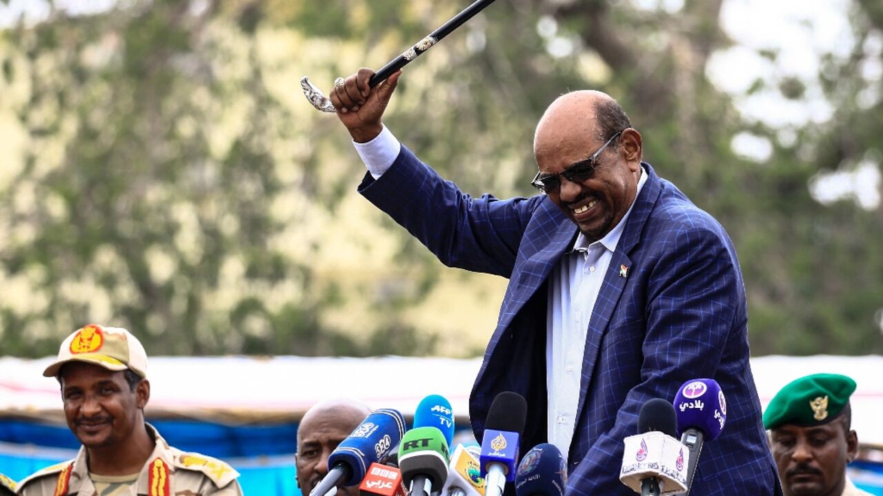 Sudan's former dictator Omar al-Bashir, on the right, in a file photo with his deputy-turned-rival Mohammed Hamdan Daglo