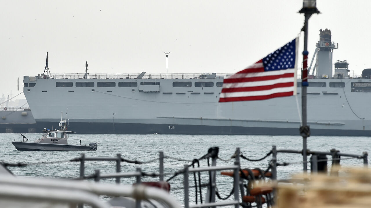 A US Navy patrol ship guards US and coalitions ships docked at the US 5th Fleet Command in Bahrain's capital Manama on Dec. 17, 2019.