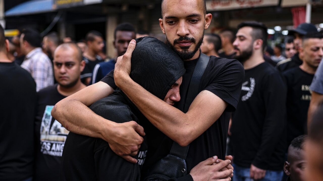 People mourn the death of two Palestinians killed by Israeli troops in a morning raid on Tulkarm in the occupied West Bank People mourn the death of two Palestinians killed by Israeli troops in a morning raid on Tulkarm in the occupied West Bank