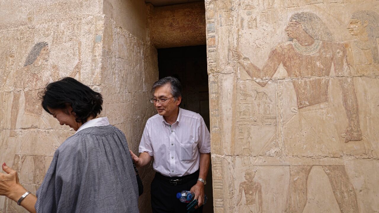 Japanese ambassador Oka Hiroshi visits a newly discovered tomb at the Saqqara archaeological site