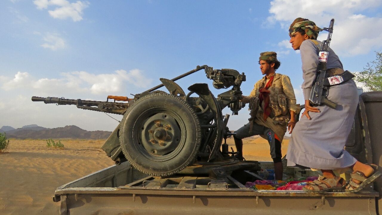 Fighters loyal to Yemen's Saudi-backed government man a position near al-Jawba front line, facing Iran-backed Huthi rebels, in the northeastern province of Marib