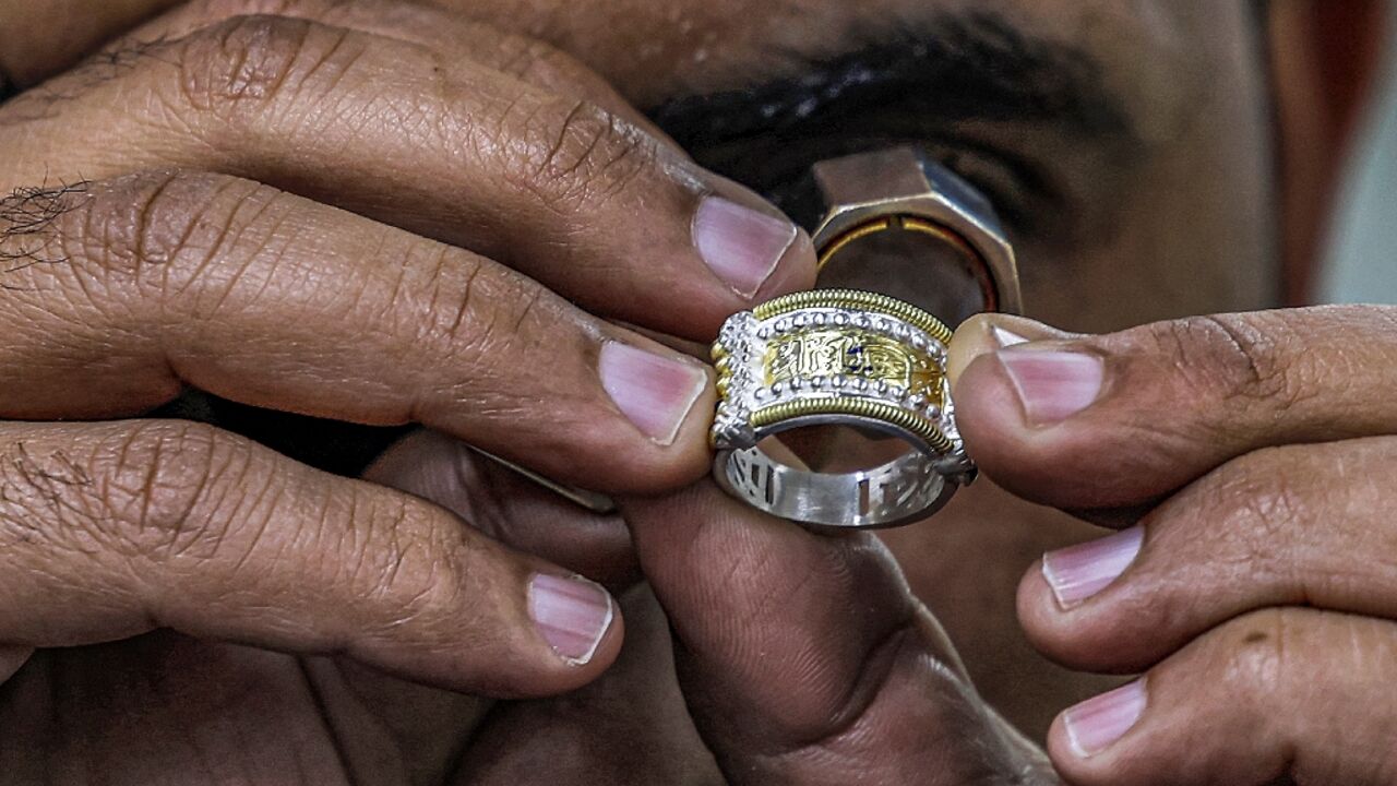 A craftsman inspects a jewellery piece at the Azza Fahmy workshop in the 6th of October industrial zone southwest of Egypt's capital A craftsman inspects a jewellery piece at the Azza Fahmy workshop in the 6th of October industrial zone southwest of Egypt's capital