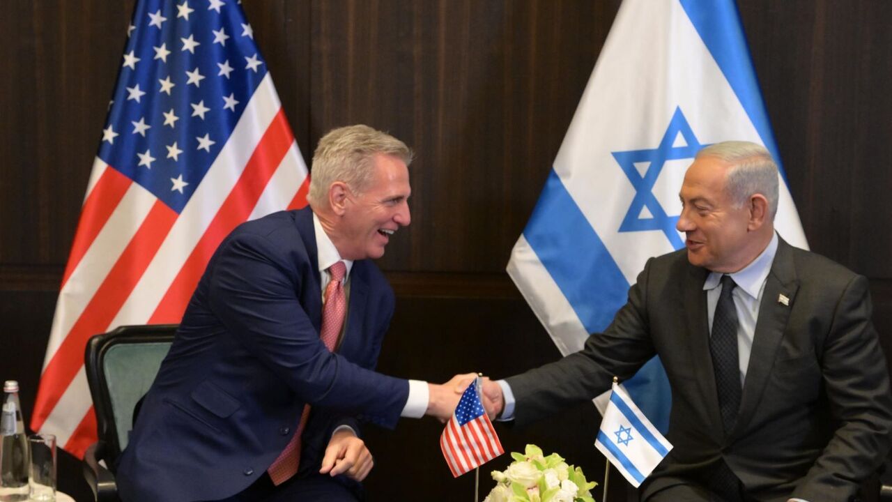  In this handout image provided by the Israeli Government Press Office (GPO), Israeli Prime Minister Benjamin Netanyahu shakes hands with US Congressman Kevin McCarthy (L) at the Prime Minister's office on