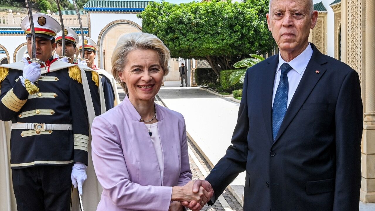 Tunisia's President Kais Saied (R) with European Commission President Ursula von der Leyen, who visited with the Italian and Dutch prime ministers