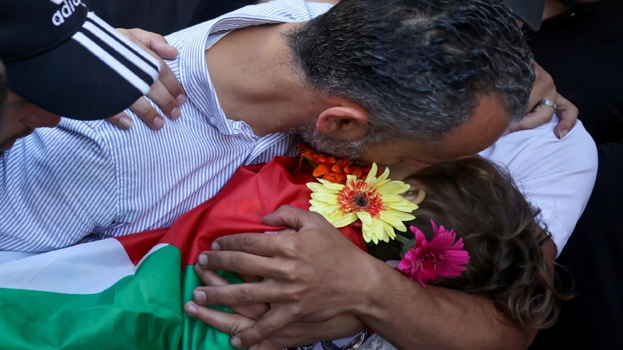 Palestinian mourners carry the body of three-year-old Mohammed Haitham al-Tamimi who was shot by Israeli forces in the occupied West Bank last week and died of his wounds on June 5, 2023 Palestinian mourners carry the body of three-year-old Mohammed Haitham al-Tamimi who was shot by Israeli forces in the occupied West Bank last week and died of his wounds on June 5, 2023