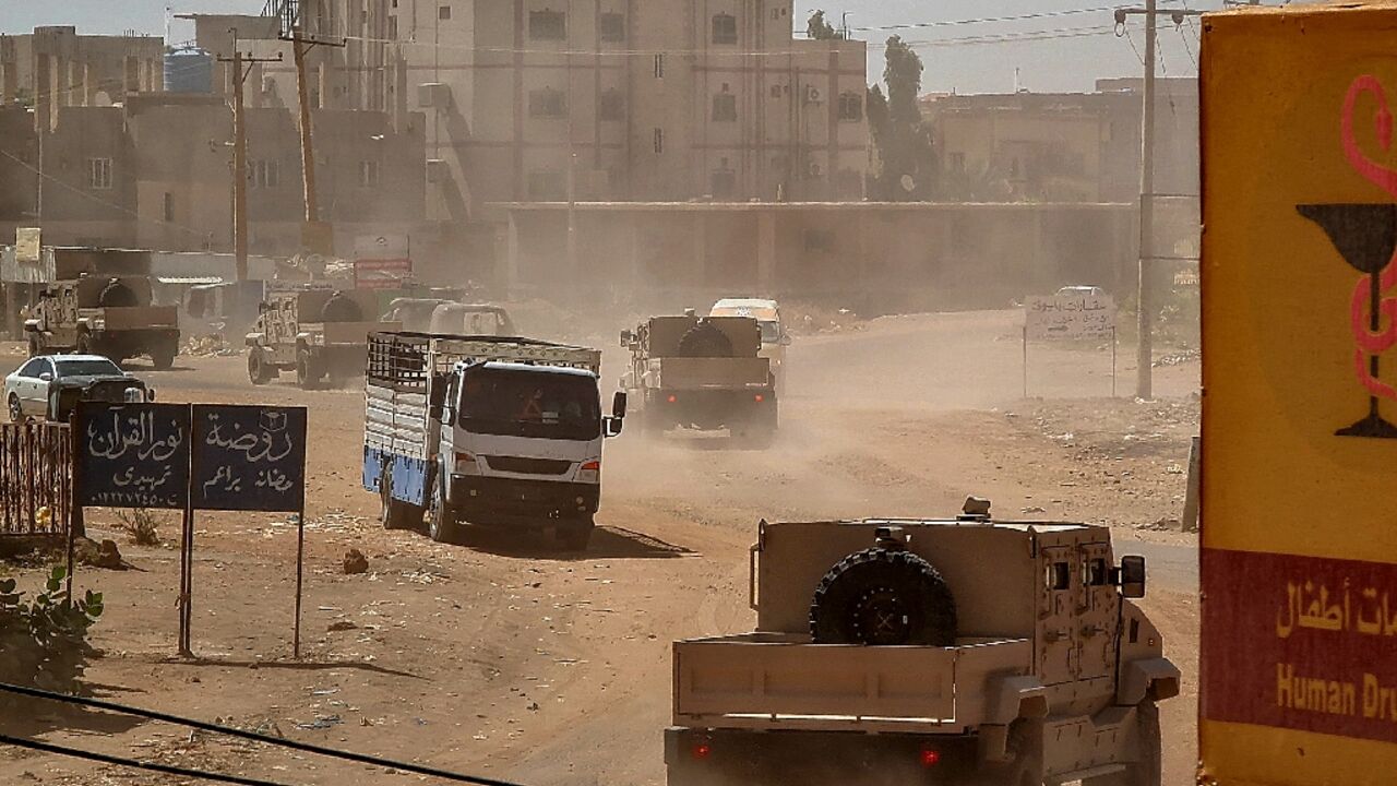 Sudanese army armoured vehicles drive in Khartoum, after paramalitaries seized the Central Reserve police headquarters in the city's south Sudanese army armoured vehicles drive in Khartoum, after paramalitaries seized the Central Reserve police headquarters in the city's south