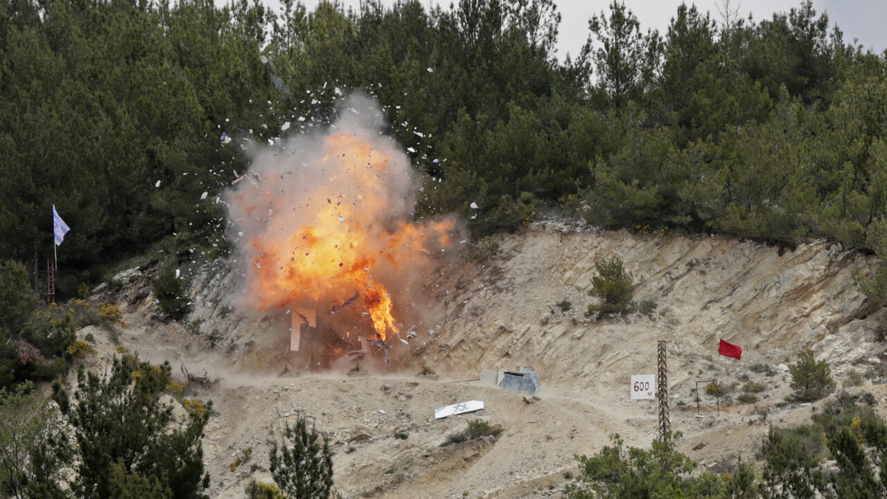 Smoke and fire billow during mock cross-border raids by Lebanon's Hezbollah movement, part of large-scale military exercise, in Aaramta bordering Israel on May 21, 2023 ahead of the anniversary of Israel's withdrawal from southern Lebanon in 2000. (Photo by ANWAR AMRO / AFP) (Photo by ANWAR AMRO/AFP via Getty Images)