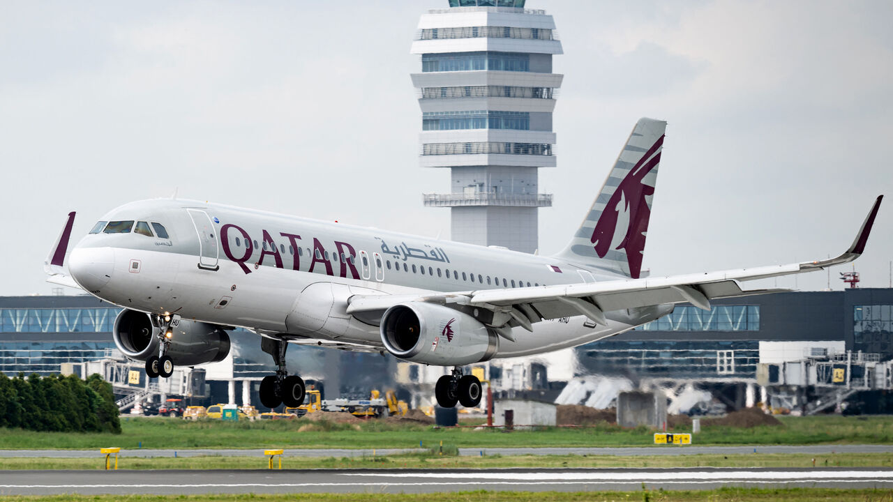 This photograph taken on June 7, 2023, shows an Qatar Airways Airbus A320 aircraft landing at the newly opened runway of Belgrade Nikola Tesla airport. The opening of Belgrade airport's new runway marked the completion of one of the major infrastructure projects undertaken by French operator Vinci, since taking over the concession in late 2018. (Photo by Andrej ISAKOVIC / AFP) (Photo by ANDREJ ISAKOVIC/AFP via Getty Images)