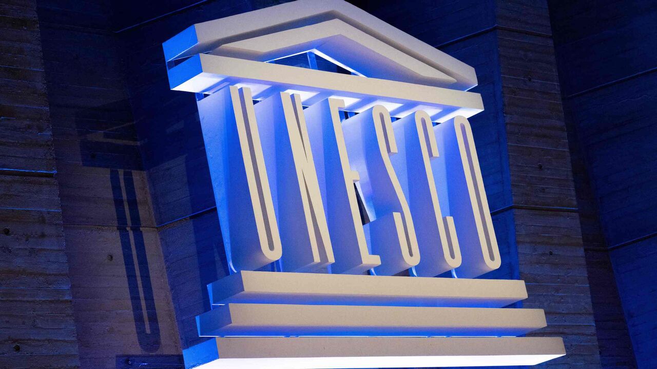 A photo shows the UNESCO logo during a speech by its director-general to announce the United States' request to return to the institution, at the UNESCO headquarters in Paris, on June 12, 2023.