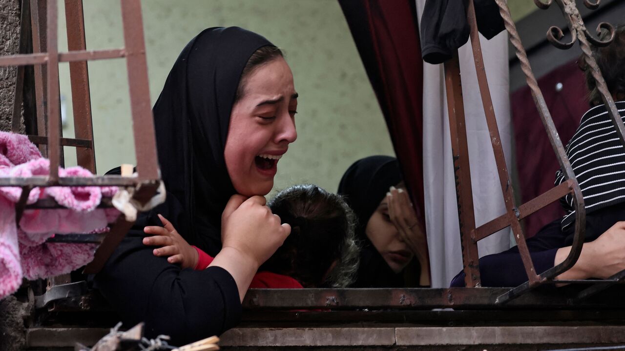 Palestinian relatives mourn during the funeral of Faris Hashash, 19, who was killed during clashes with Israeli forces at the Balata refugee camp on the outskirts of Nablus, in the occupied West Bank, on June 13, 2023. (Photo by Jaafar ASHTIYEH / AFP) (Photo by JAAFAR ASHTIYEH/AFP via Getty Images)